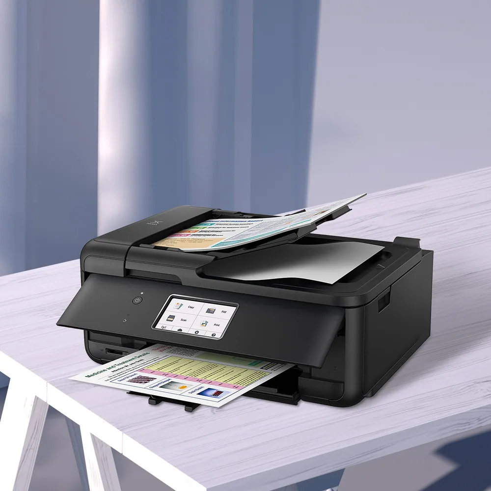 An inkjet all-in-one printer on a white table with printed photos