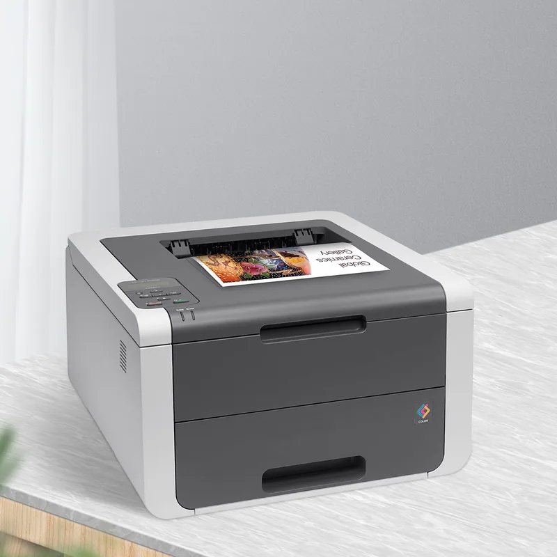 A color laser printer on a white desk with a printed page in the tray